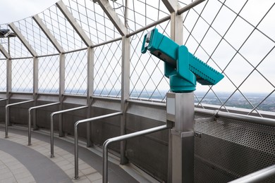 Photo of Green metal tower viewer on observation deck