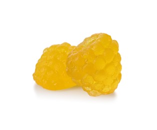 Photo of Delicious gummy golden raspberry candies on white background