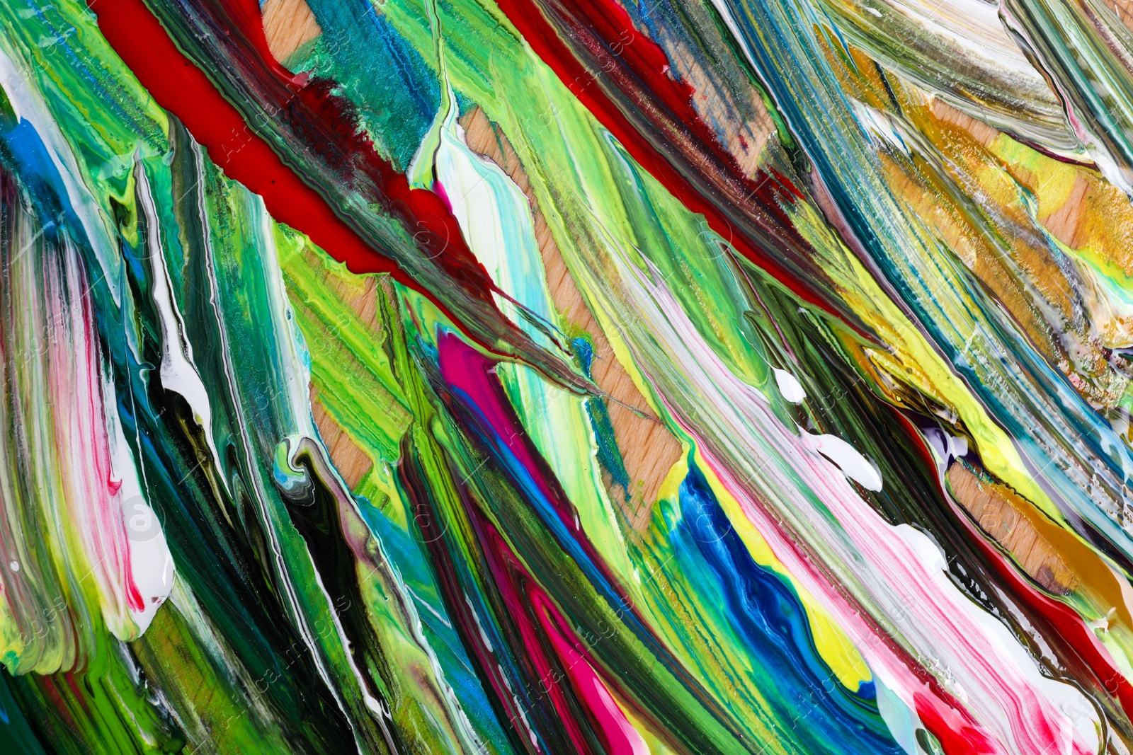 Photo of Abstract colorful acrylic paint as background, top view