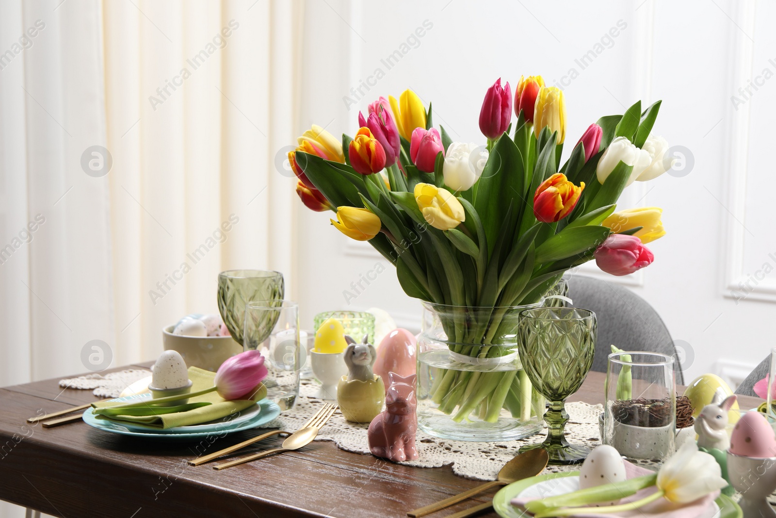 Photo of Festive table setting with beautiful flowers. Easter celebration