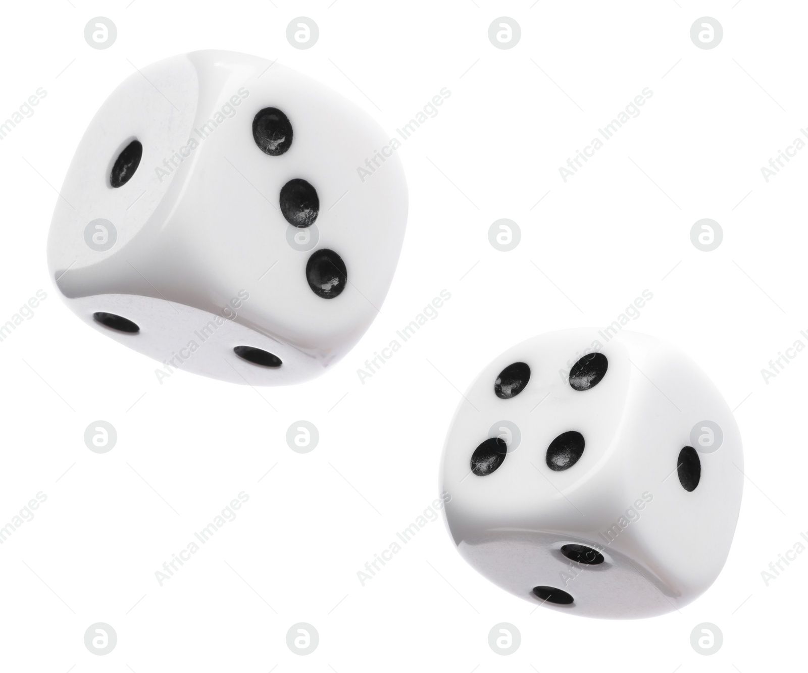 Image of Two dice in air on white background