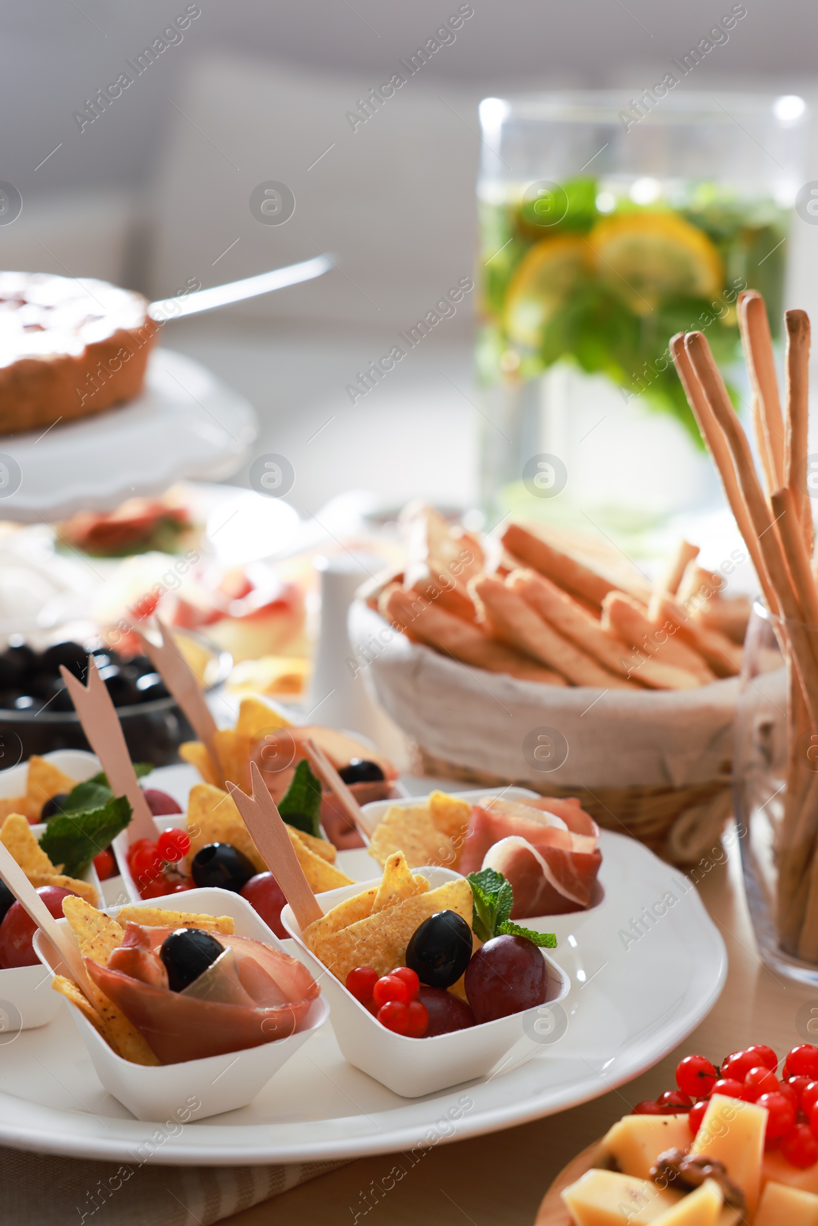 Photo of Dishes with different food on table in room. Luxury brunch