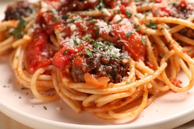 Photo of Delicious pasta with meatballs and tomato sauce on table, closeup