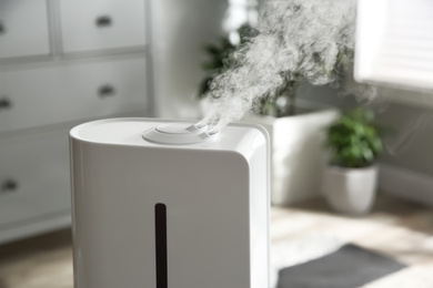 Modern air humidifier at home, closeup view