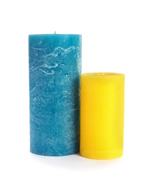 Photo of Two decorative wax candles on white background