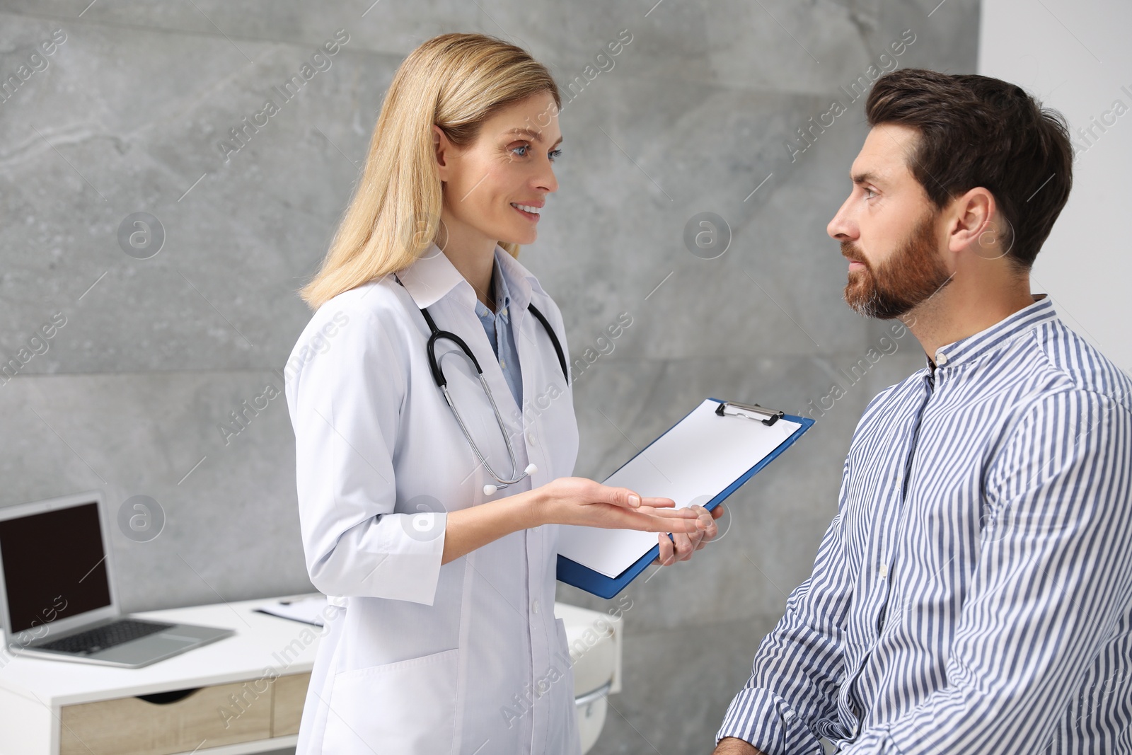 Photo of Patient having appointment with doctor in clinic