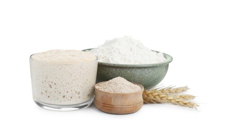 Photo of Leaven, flour, and ears of wheat isolated on white