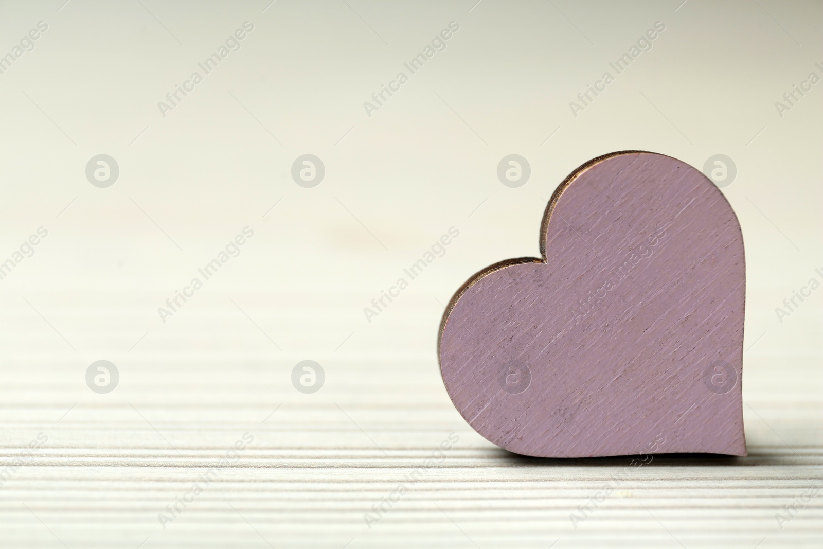 Photo of Decorative heart on white background, closeup with 
space for text. Valentine's day