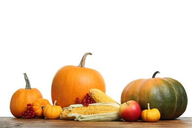 Photo of Happy Thanksgiving day. Composition with pumpkins, berries and corn cobs on wooden table against white background