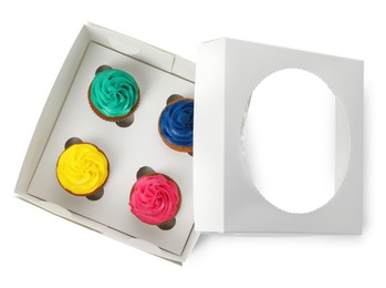 Box with different cupcakes on white background, top view