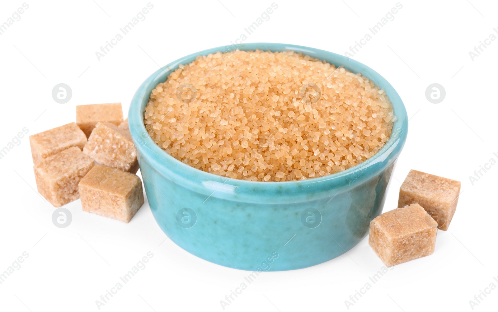 Photo of Different types of brown sugar and bowl isolated on white