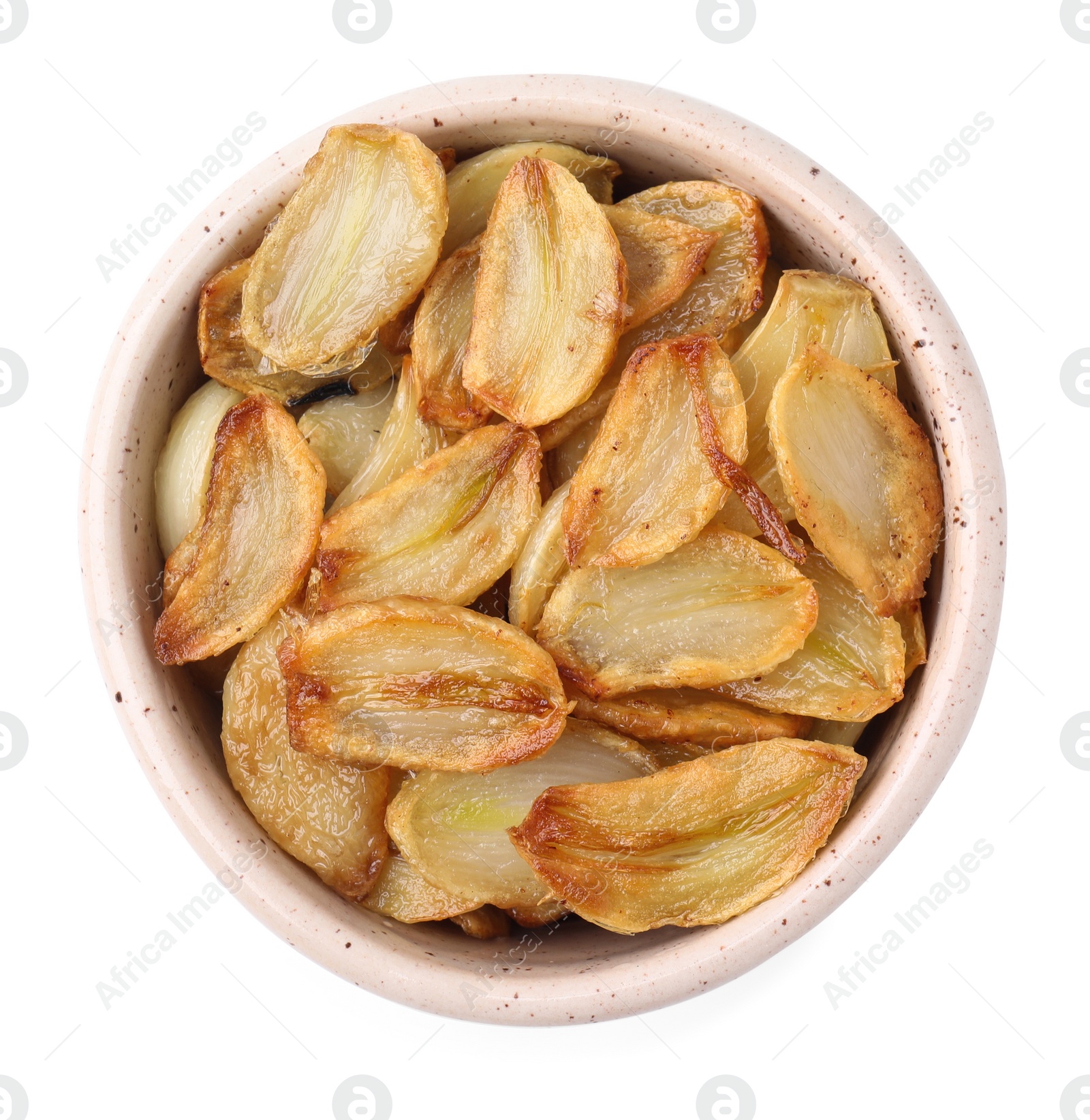 Photo of Fried garlic cloves in bowl isolated on white, top view