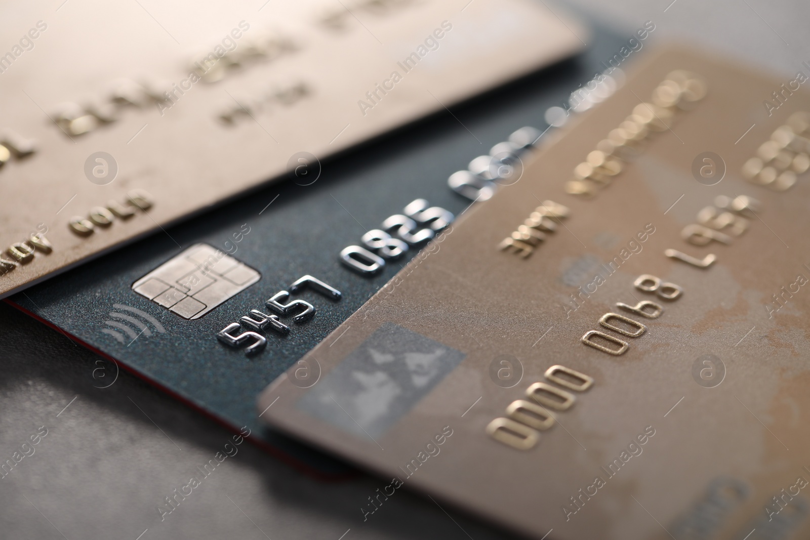 Photo of Plastic credit cards on table, macro view