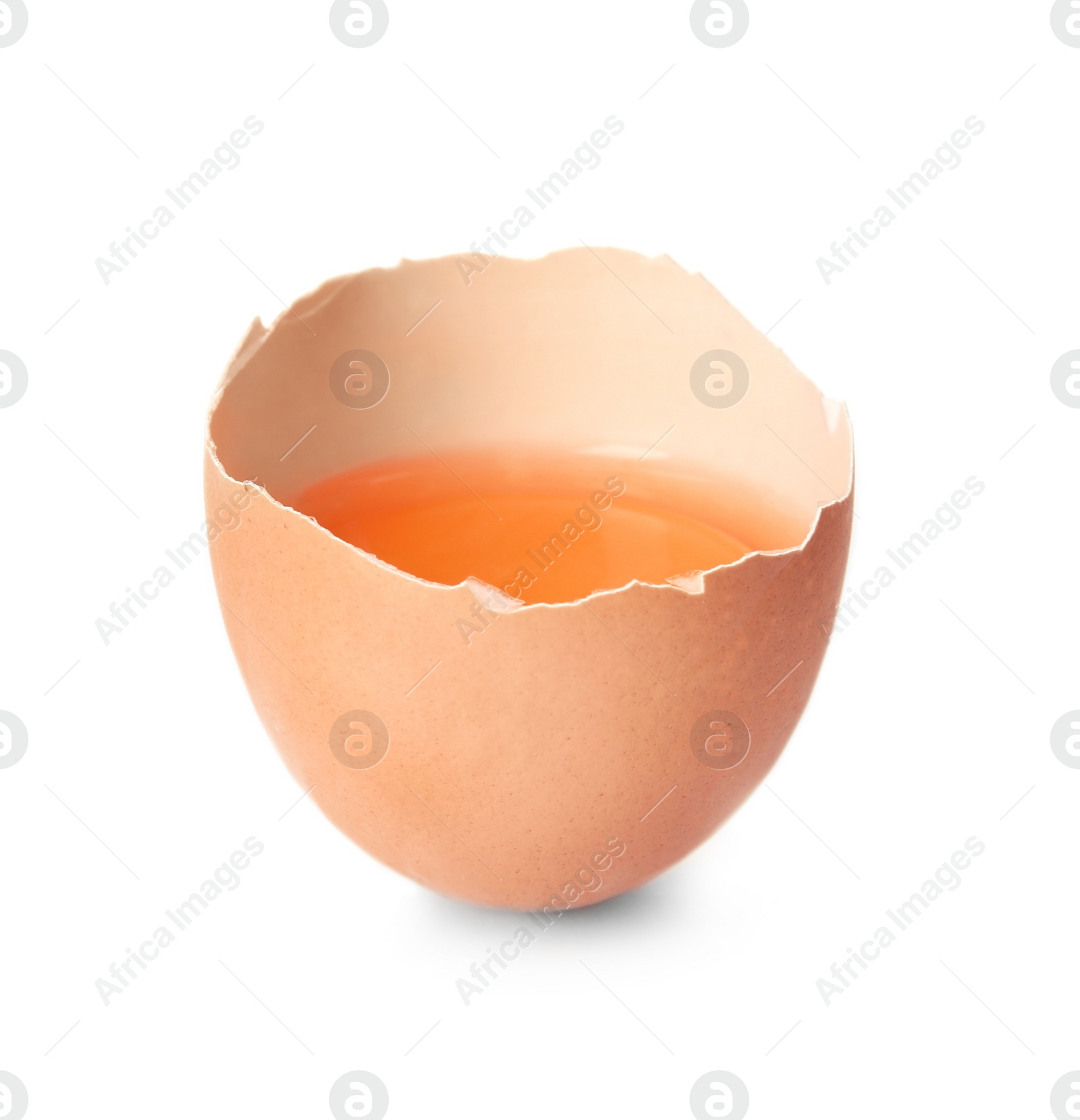 Photo of Cracked raw chicken egg with yolk on white background