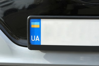 Photo of Car with vehicle registration plate, closeup view