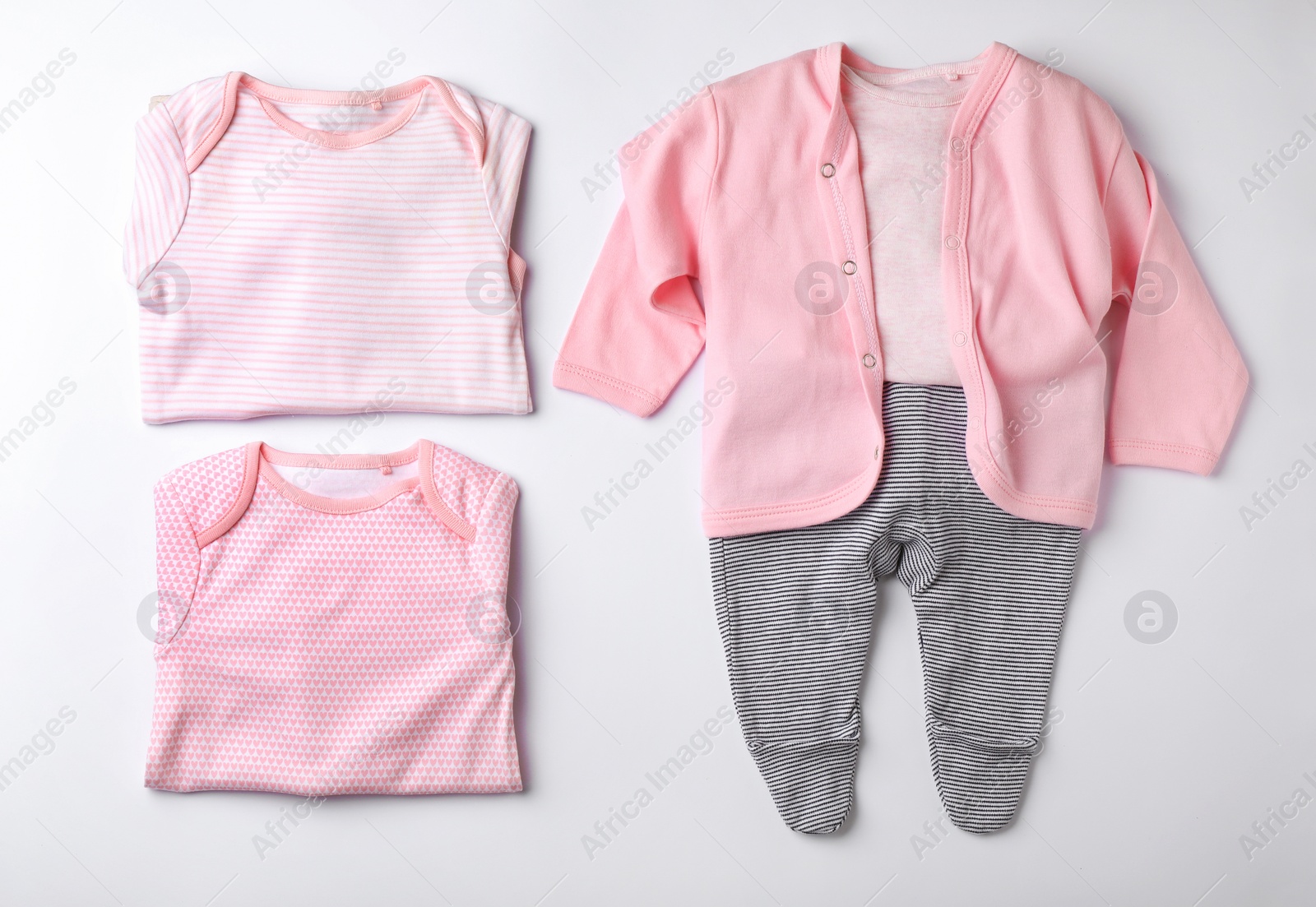 Photo of Flat lay composition with clothes for baby on white background