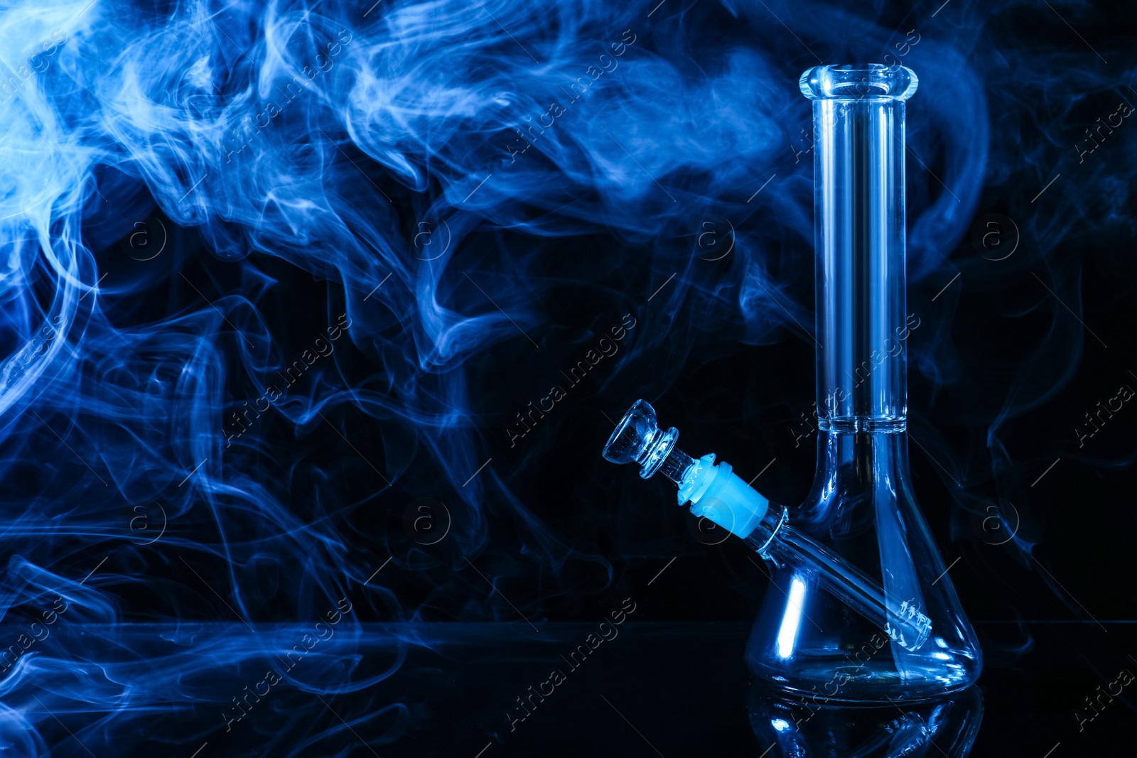 Photo of Glass bong and smoke on black background, space for text. Smoking device