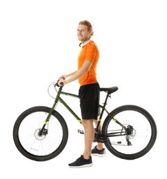 Happy young man with headphones and bicycle on white background