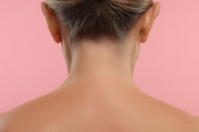 Photo of Mature woman with healthy skin on pink background, closeup