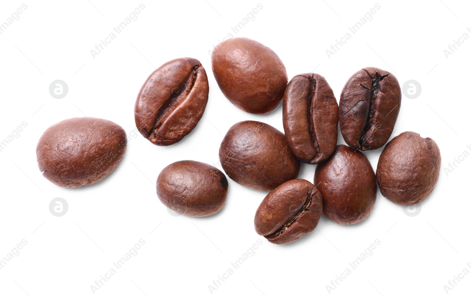 Photo of Many roasted coffee beans isolated on white, top view