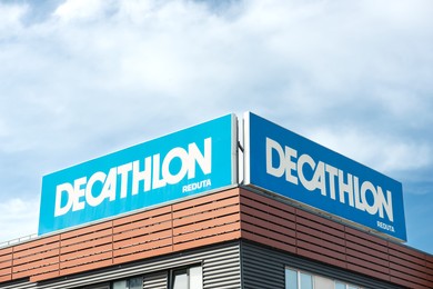 Warsaw, Poland - September 08, 2022: Shopping centre with Decathlon logo under cloudy sky