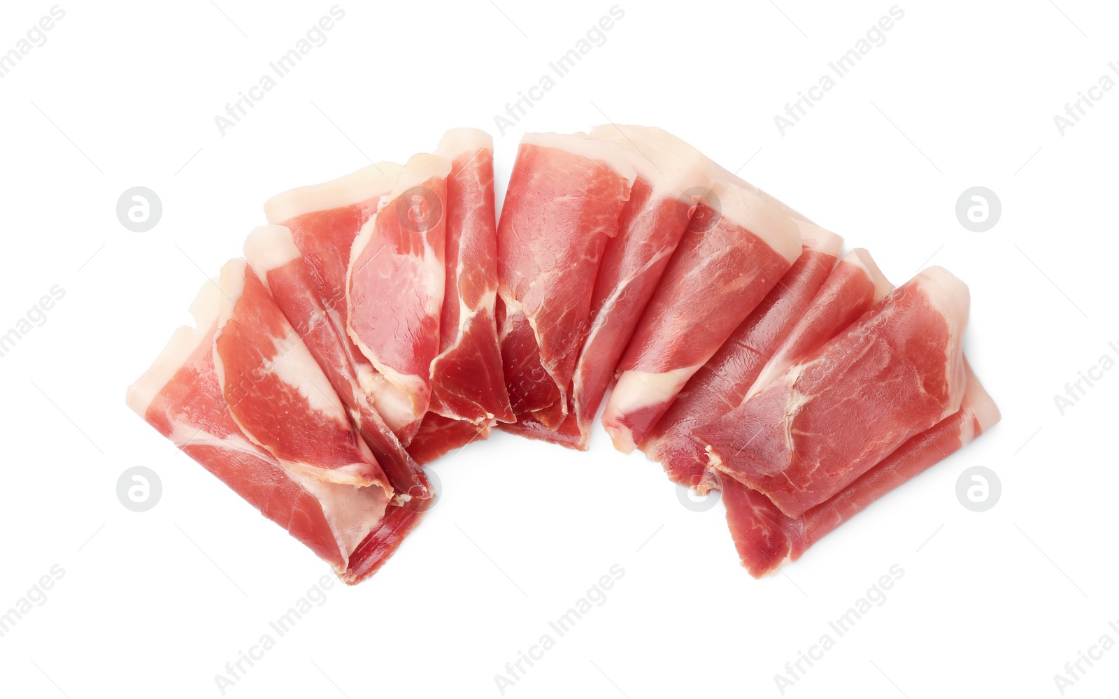 Photo of Slices of delicious jamon on white background, top view