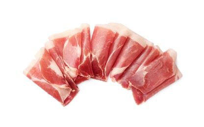 Slices of delicious jamon on white background, top view