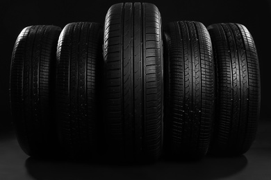 New car tires on black background