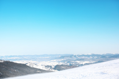 Photo of Beautiful view on snowy mountains. Winter vacation