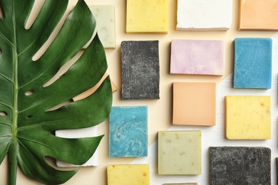 Flat lay composition with handmade soap bars on color background