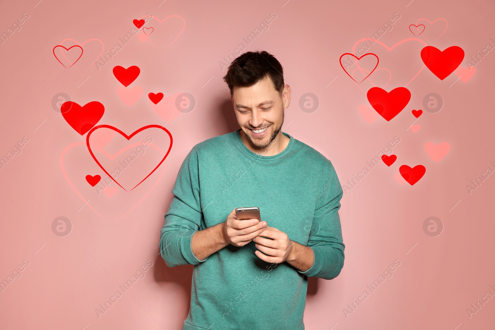 Image of Man visiting dating site via smartphone on color background