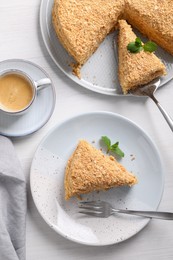 Delicious Napoleon cake served on table, flat lay