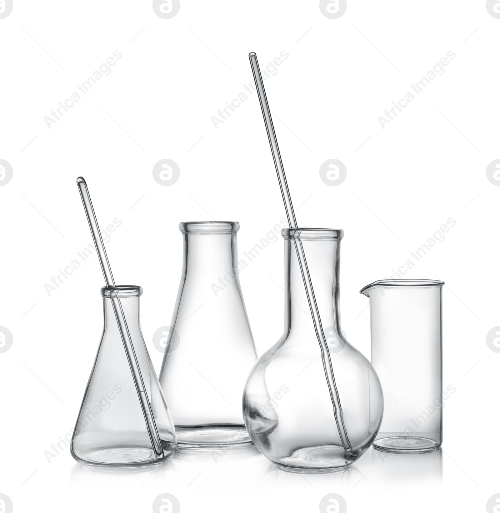 Photo of Clean empty laboratory glassware on white background
