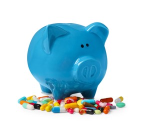 Piggy bank and pills on white background. Medical insurance