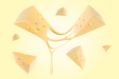 Image of Piecescheese falling on yellow background