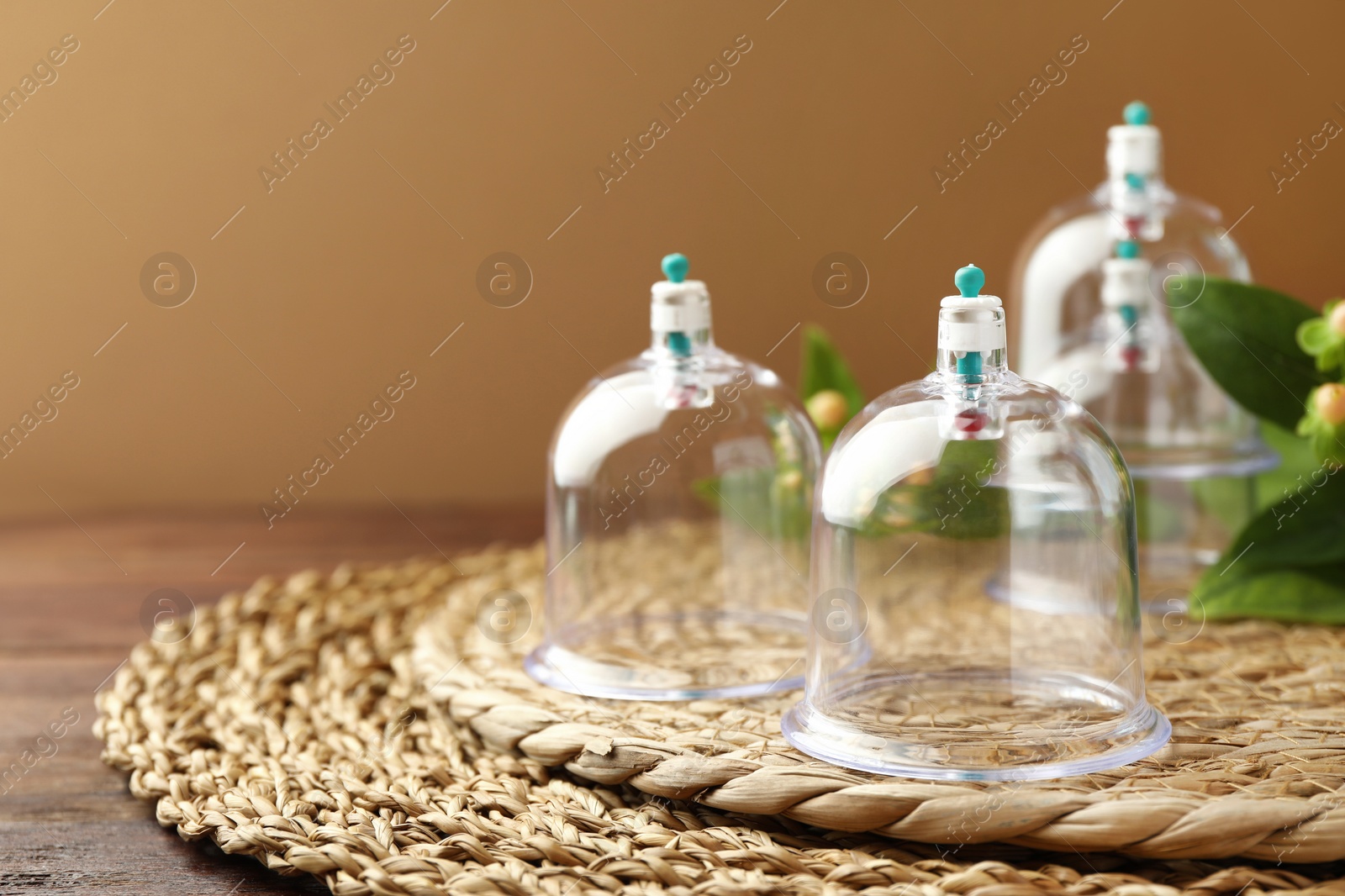 Photo of Cupping therapy. Plastic cups on table, closeup. Space for text