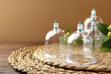 Cupping therapy. Plastic cups on table, closeup. Space for text