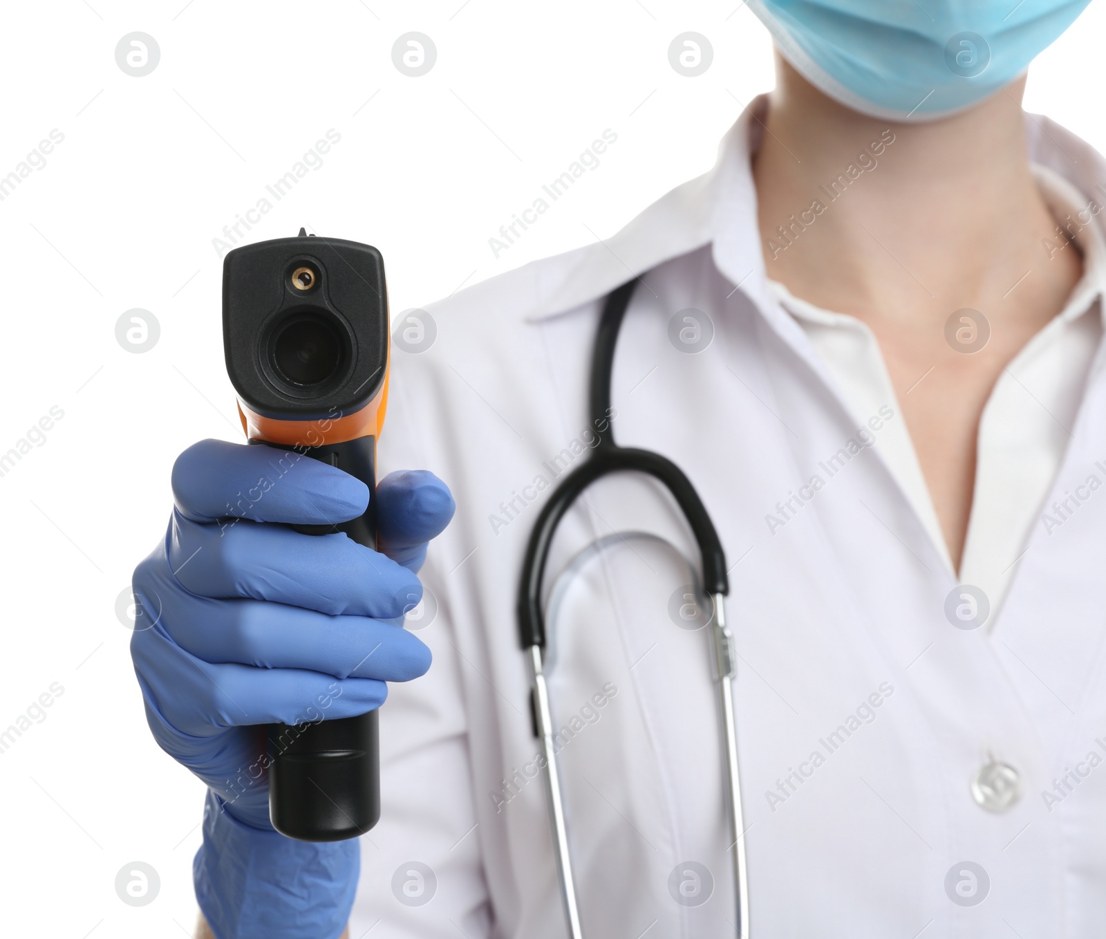 Photo of Doctor in latex gloves holding non contact infrared thermometer on white background, closeup. Measuring temperature