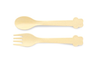 Photo of Plastic cutlery on white background, top view. Serving baby food