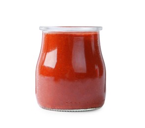 Red curry paste in glass jar isolated on white