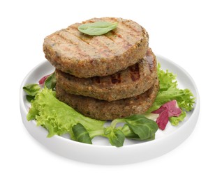 Photo of Plate of delicious vegan cutlets, lettuce and spinach isolated on white