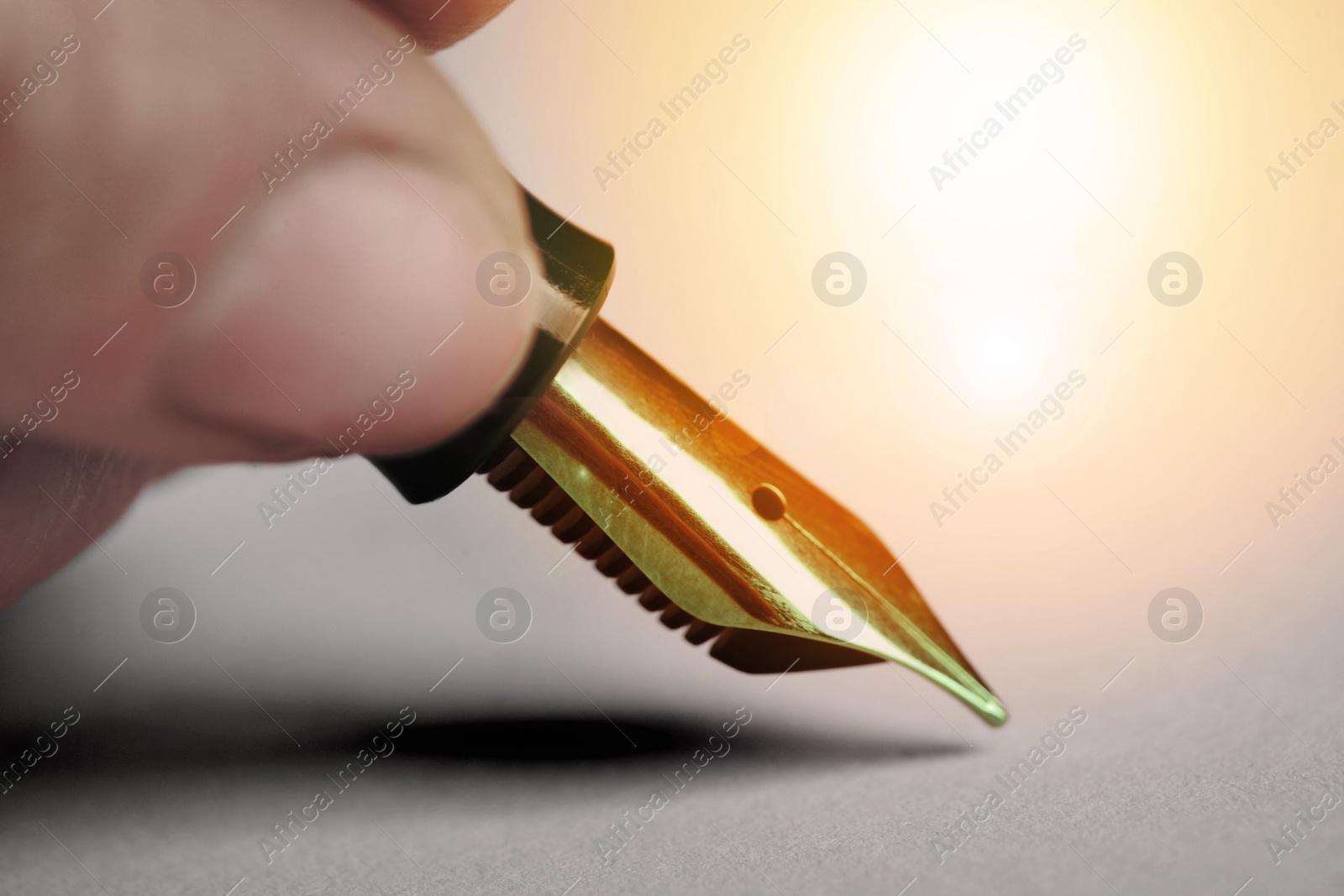 Image of Woman writing with fountain pen, closeup view