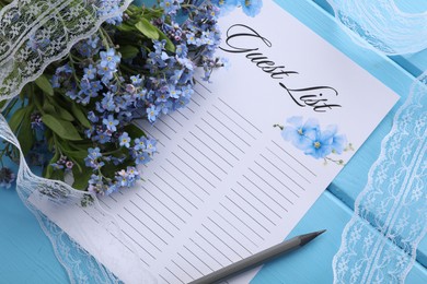 Guest list, pencil, lace ribbon and flowers on light blue wooden table, flat lay. Space for text