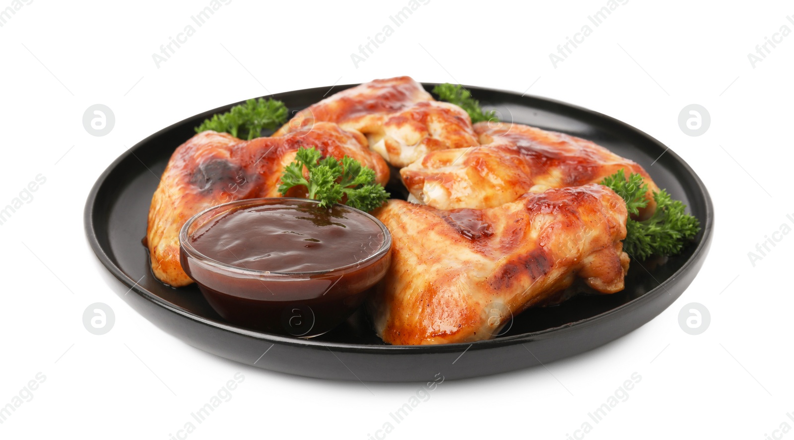 Photo of Plate with marinade and chicken wings isolated on white
