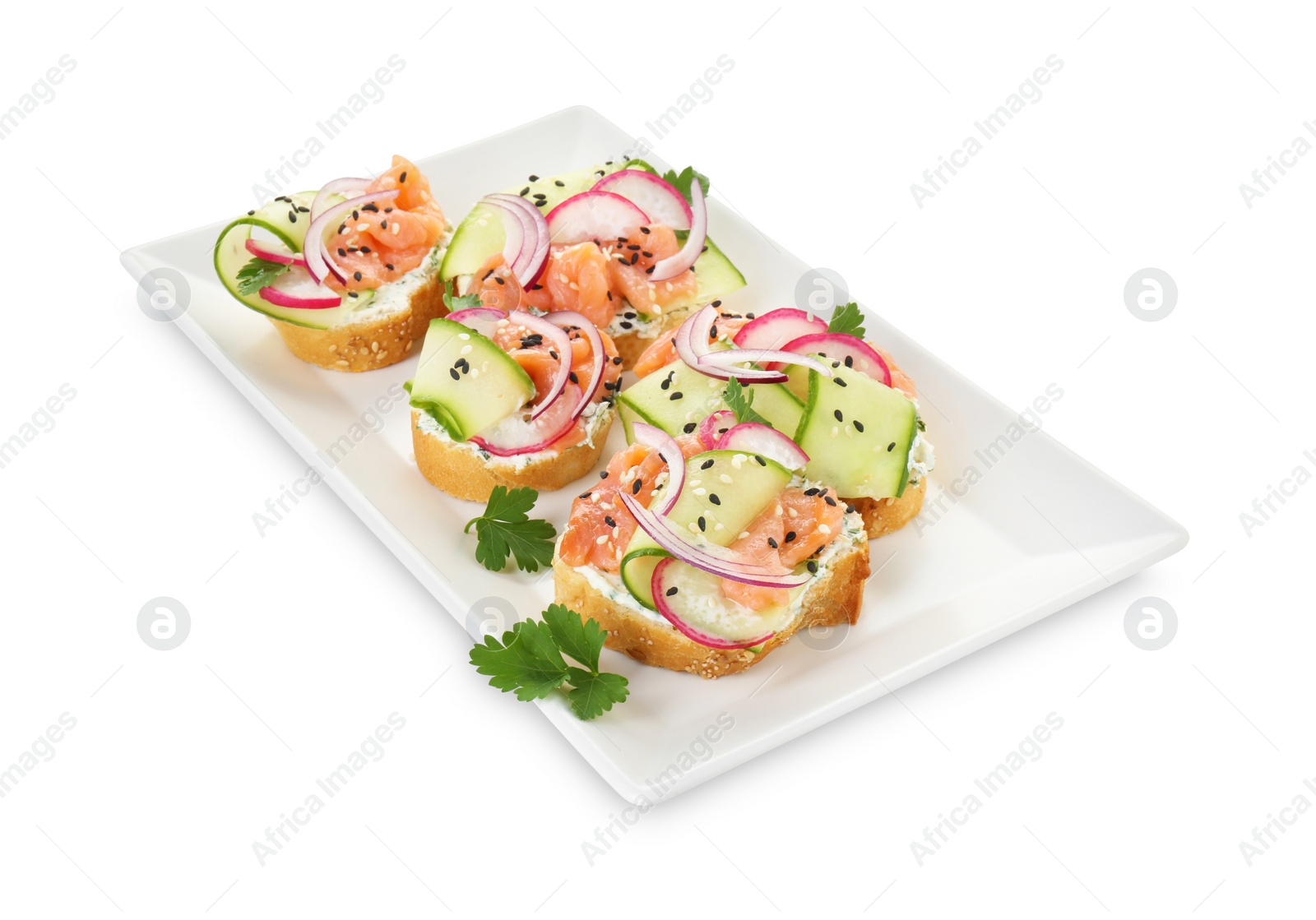 Photo of Tasty canapes with salmon, cucumber, radish and cream cheese isolated on white