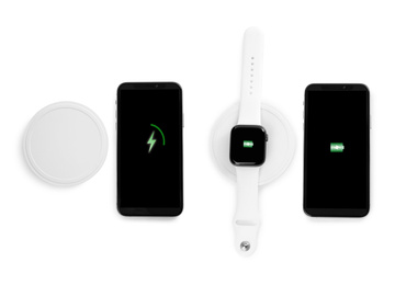 Image of Collage with wireless chargers and gadgets on white background, top view