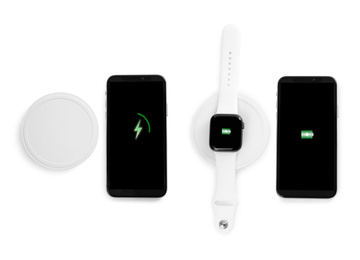 Collage with wireless chargers and gadgets on white background, top view