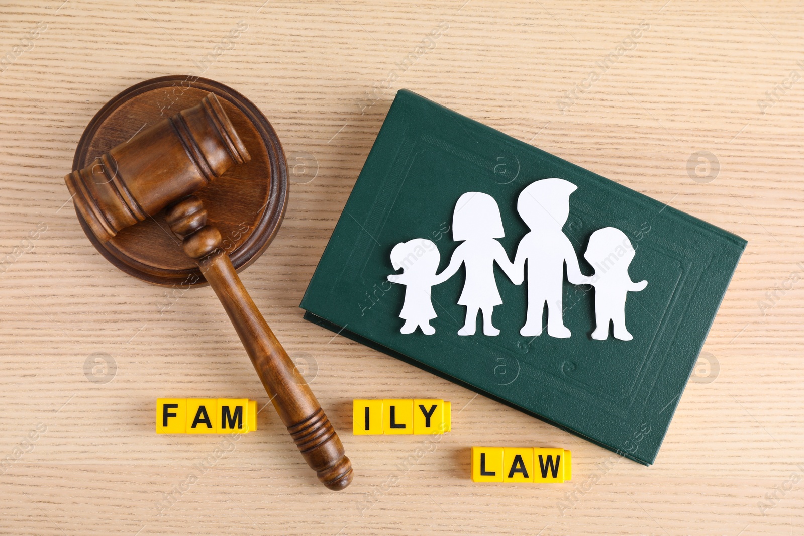 Photo of Flat lay composition with book and gavel on wooden background. Family law concept