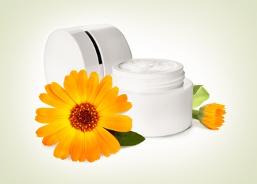 Image of Body cream with calendula extract on light background. Natural based cosmetic product