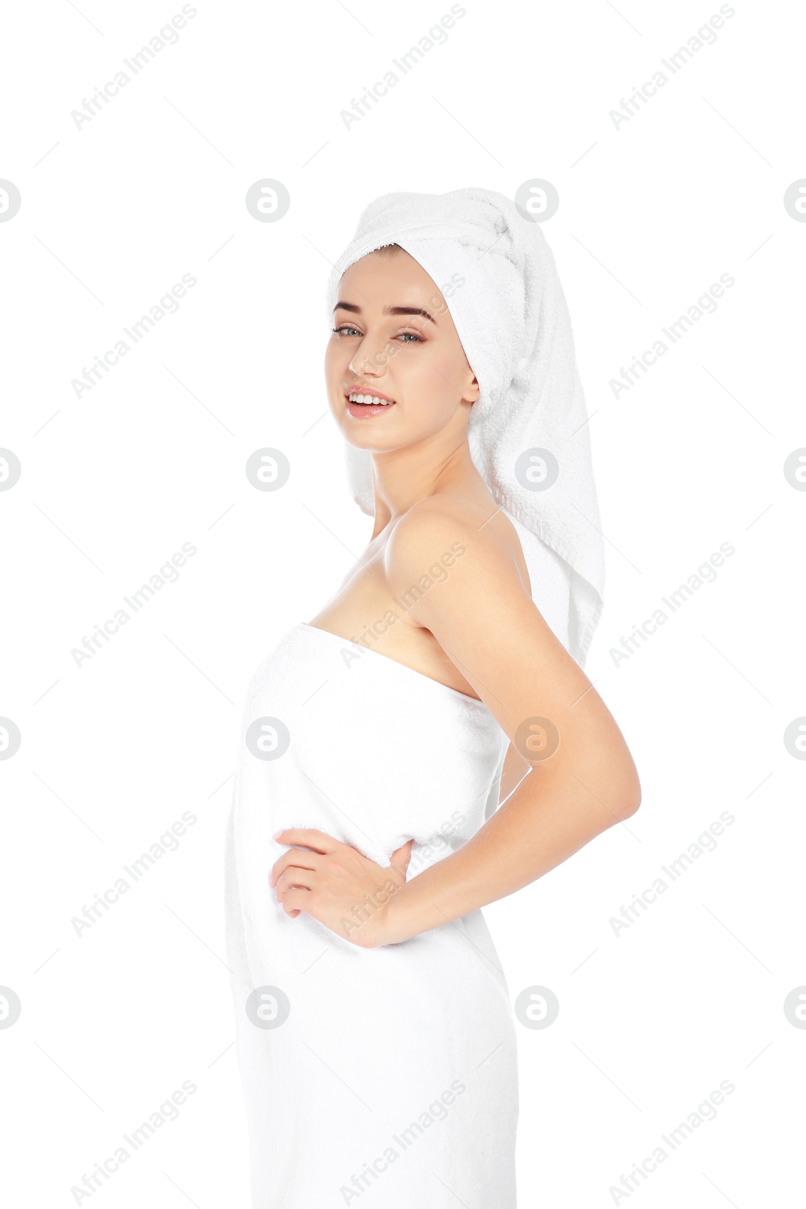 Photo of Portrait of young pretty woman with towels on white background